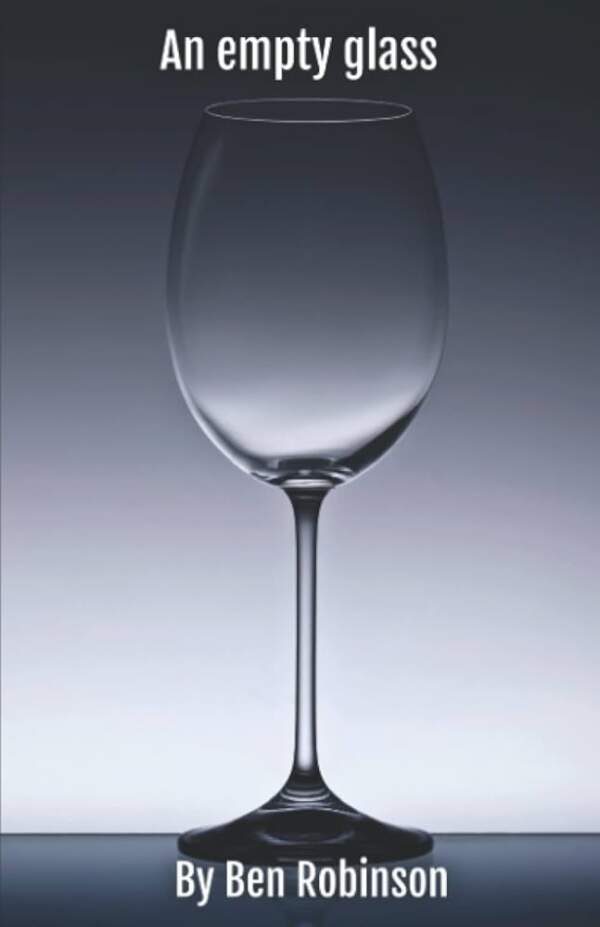 An empty glass poetry book paperback